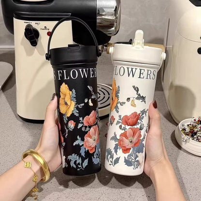 Miso station floral pattern insulated stainless steel tumblers in black and cream with carry handles and straws