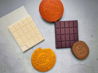 Miso station novelty food-shaped notebooks with realistic PVC covers resembling chocolate bars and round biscuits.