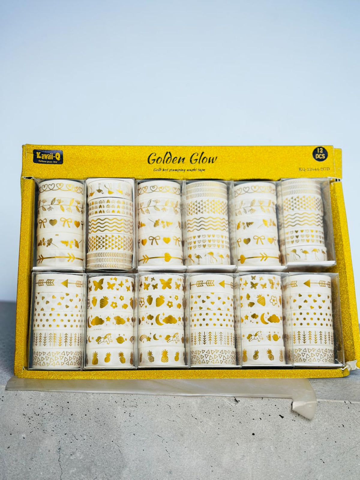 Miso station 12-piece Golden Glow washi tape set with gold hot-stamped patterns on white paper rolls in a yellow box