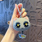 Miso station grey silicone cartoon cat keychain with large expressive eyes and a hanging kitty charm