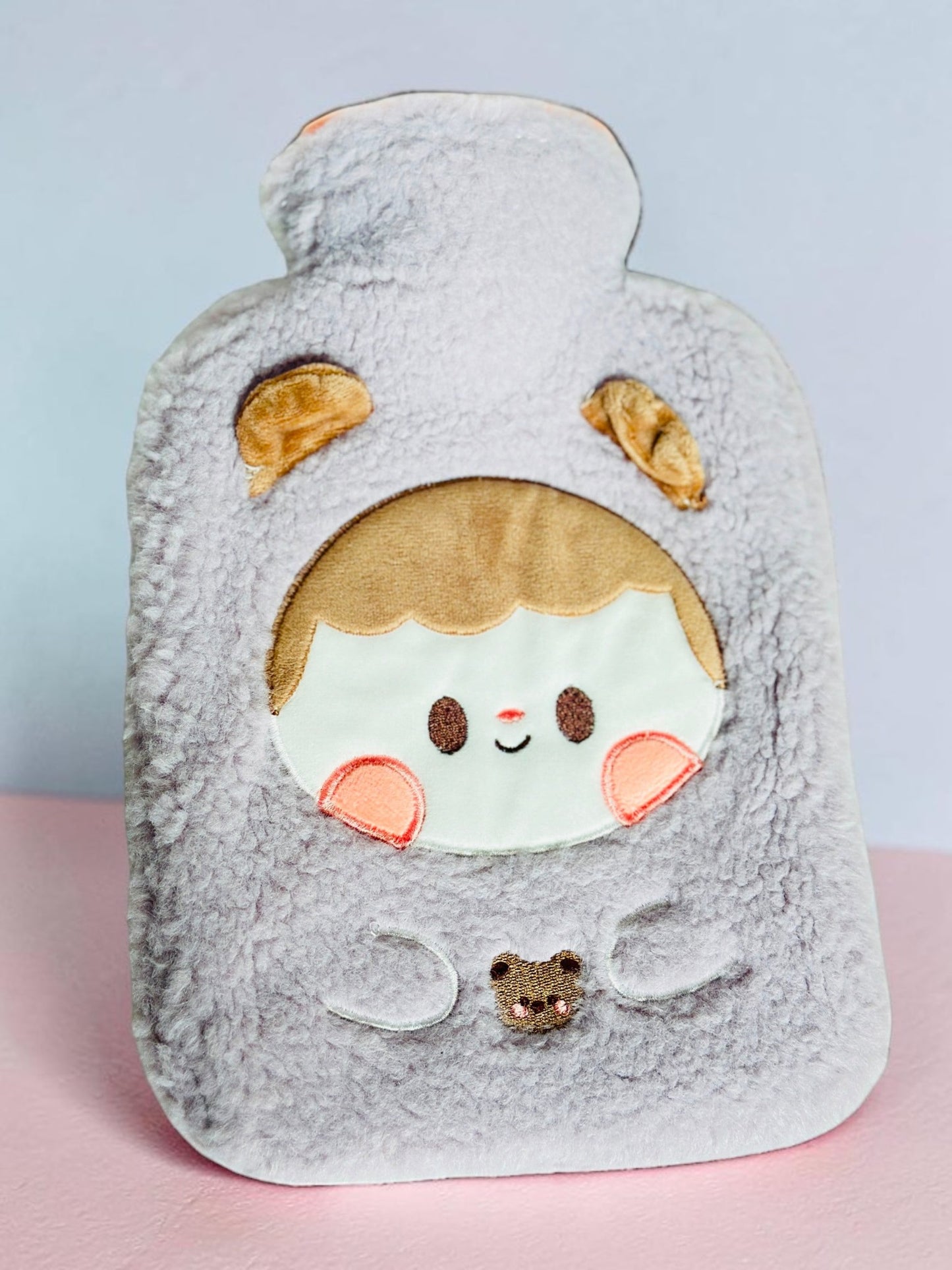 Miso station plush grey hot water bottle cover featuring an embroidered character face with 3D ears and soft fleece.