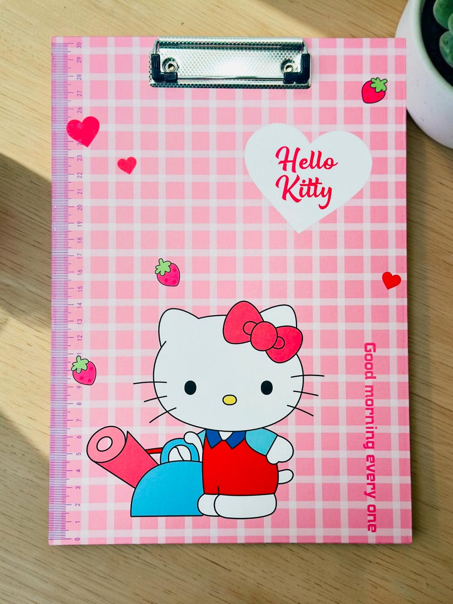 Miso station Hello Kitty clipboard with pink plaid pattern, integrated side ruler, and sturdy metal clip.