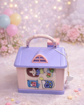 Miso station house-shaped piggy bank in pastel purple and pink with a carrying handle and secure key lock.