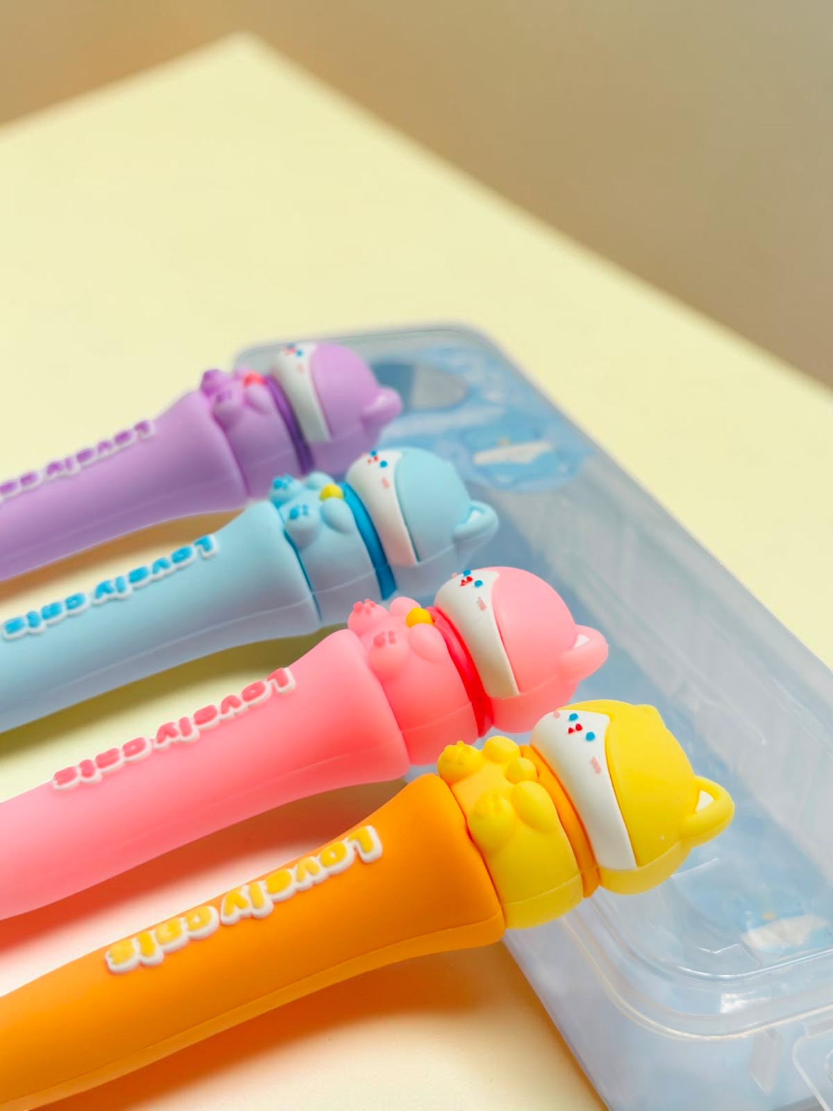 Miso station T-Brite KikiClean Lovely Cats children's toothbrushes in purple, blue, pink, and orange with travel cases