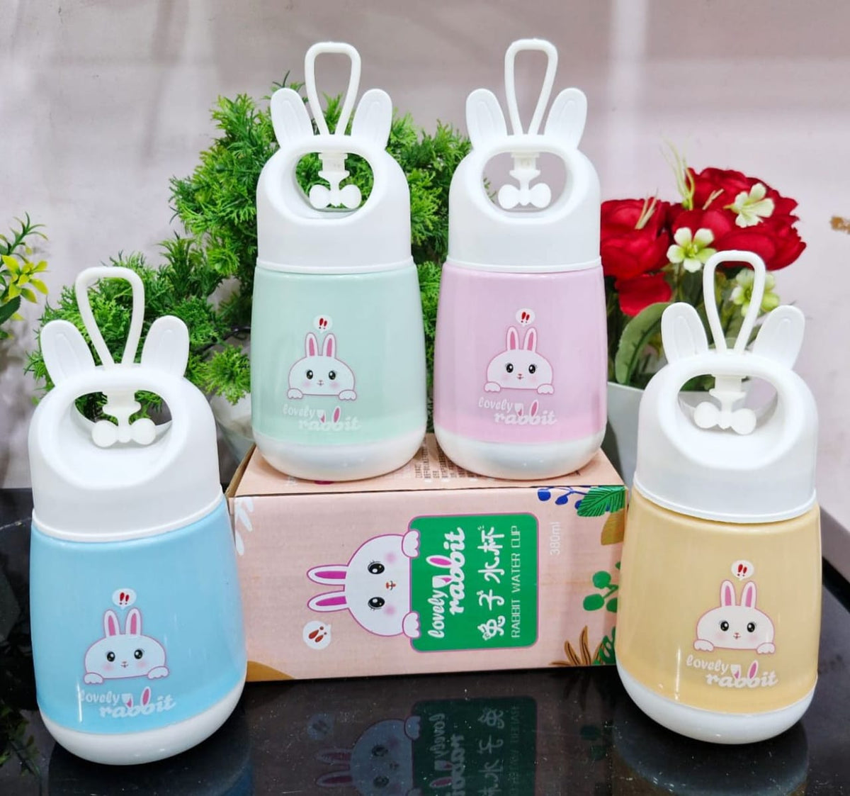 Miso station Lovely Rabbit portable 380ml water cups in pastel blue, green, pink, and yellow with rabbit ear handles.