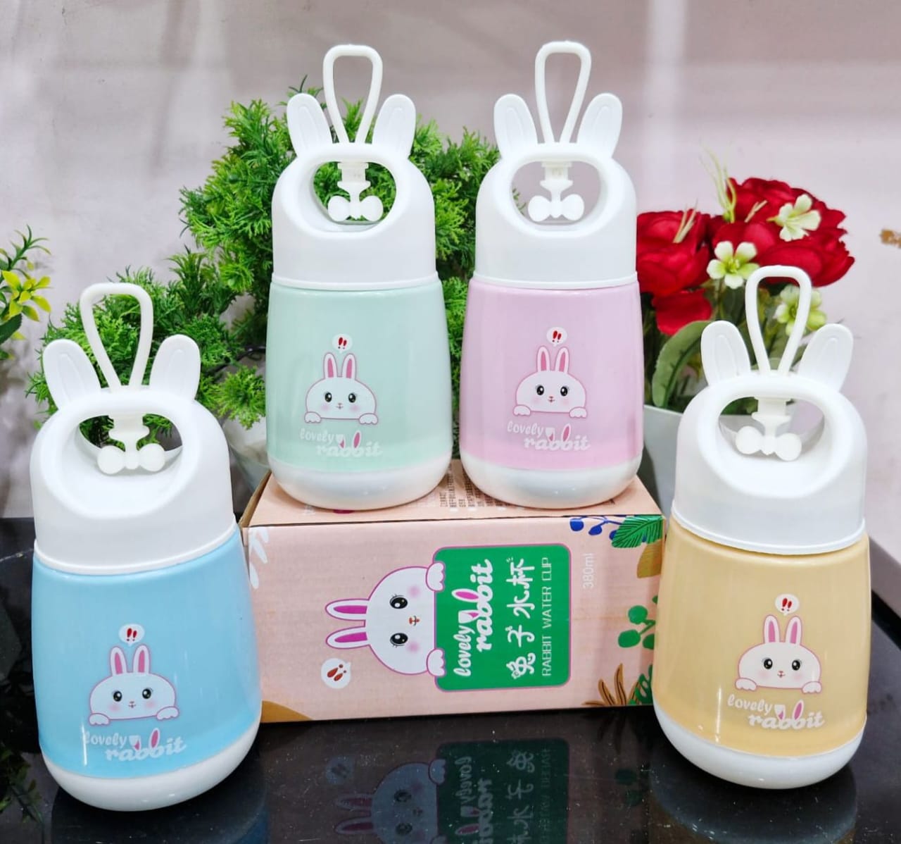 Miso station Lovely Rabbit portable 380ml water cups in pastel blue, green, pink, and yellow with rabbit ear handles.