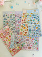 Miso station Melty Couleur puffy sticker sheets featuring colorful animals, sweets, and retro icons on various backgrounds