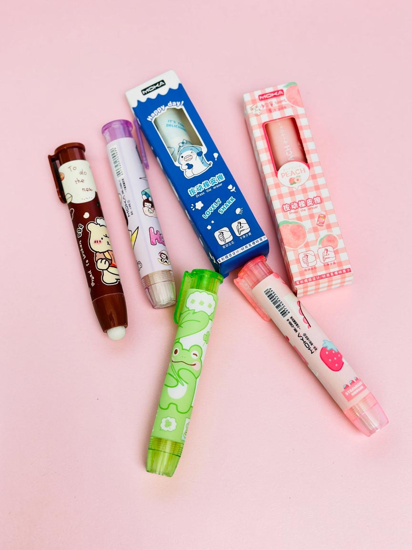 Miso station MOKA retractable pen-style erasers featuring cute animal and fruit designs on a pink background