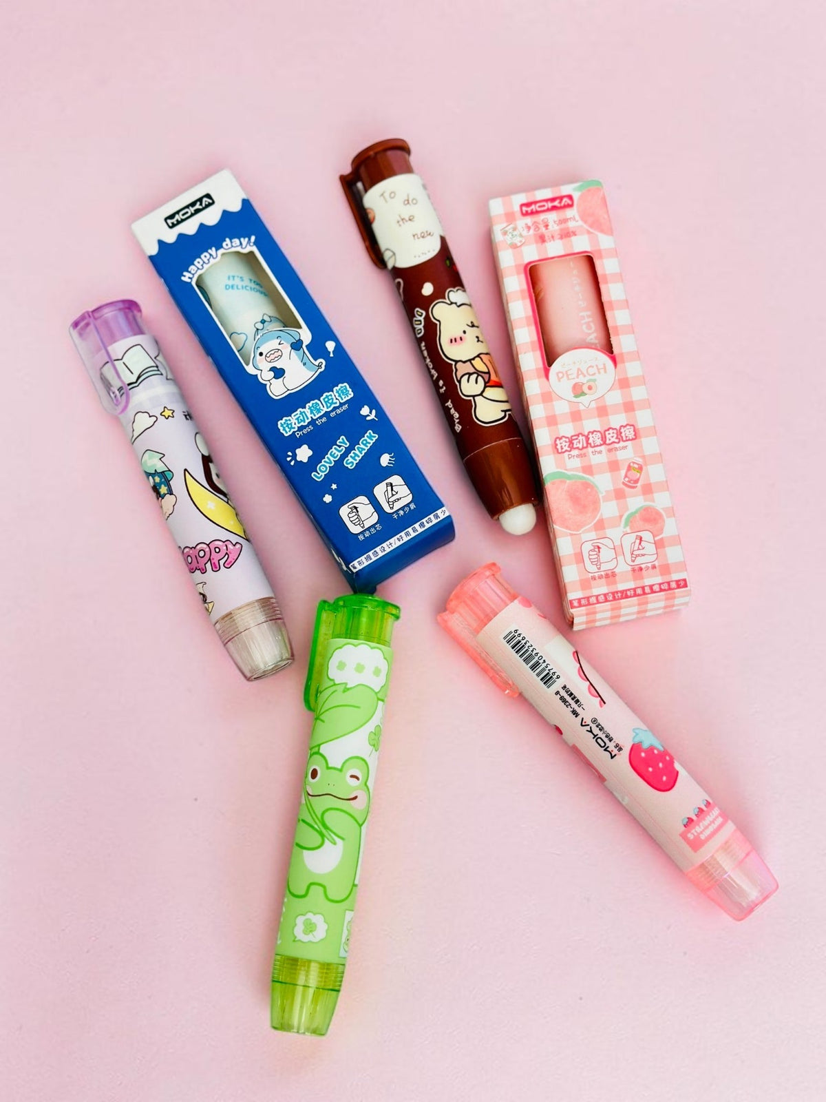 Miso station MOKA retractable pen-style erasers featuring cute animal and fruit designs in various vibrant colors.