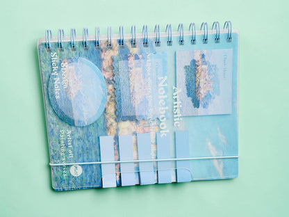 Miso station spiral notebook featuring a blue Claude Monet oil painting cover with integrated sticky notes.