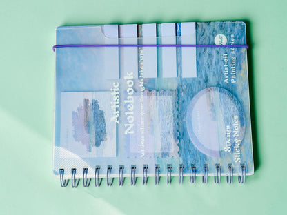 Miso station spiral notebook featuring a blue oil painting cover with integrated sticky notes and page markers.