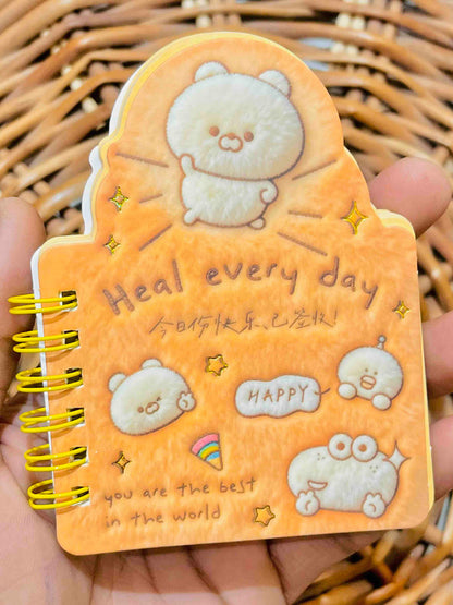 Miso station plush spiral memo notepad in orange with cute cartoon bear characters and uplifting text