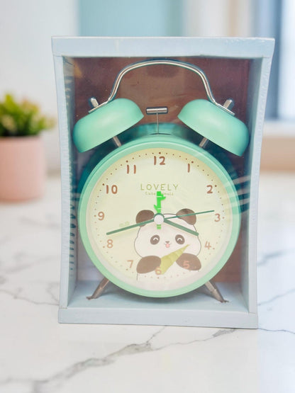 Miso station pastel green twin-bell analog alarm clock featuring a cute panda illustration on the dial in packaging.