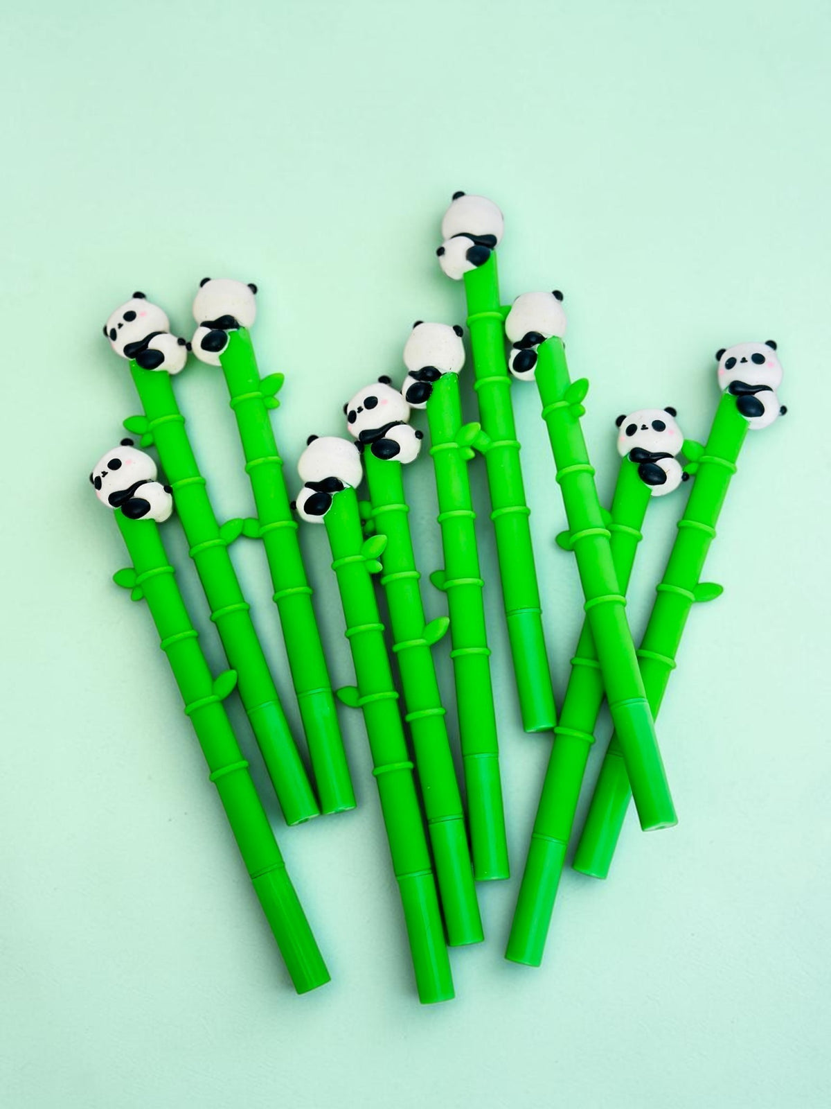Miso station green bamboo-shaped gel pens with cute panda toppers for a fun and whimsical stationery collection.