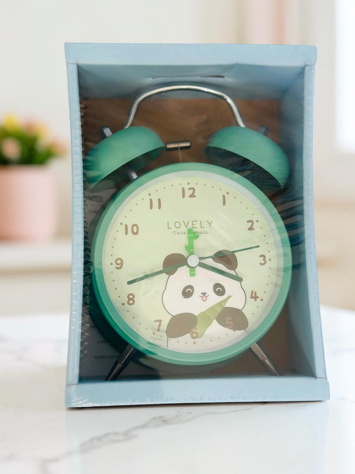 Miso station twin-bell analog alarm clock in mint green with a cute panda illustration on the dial in packaging