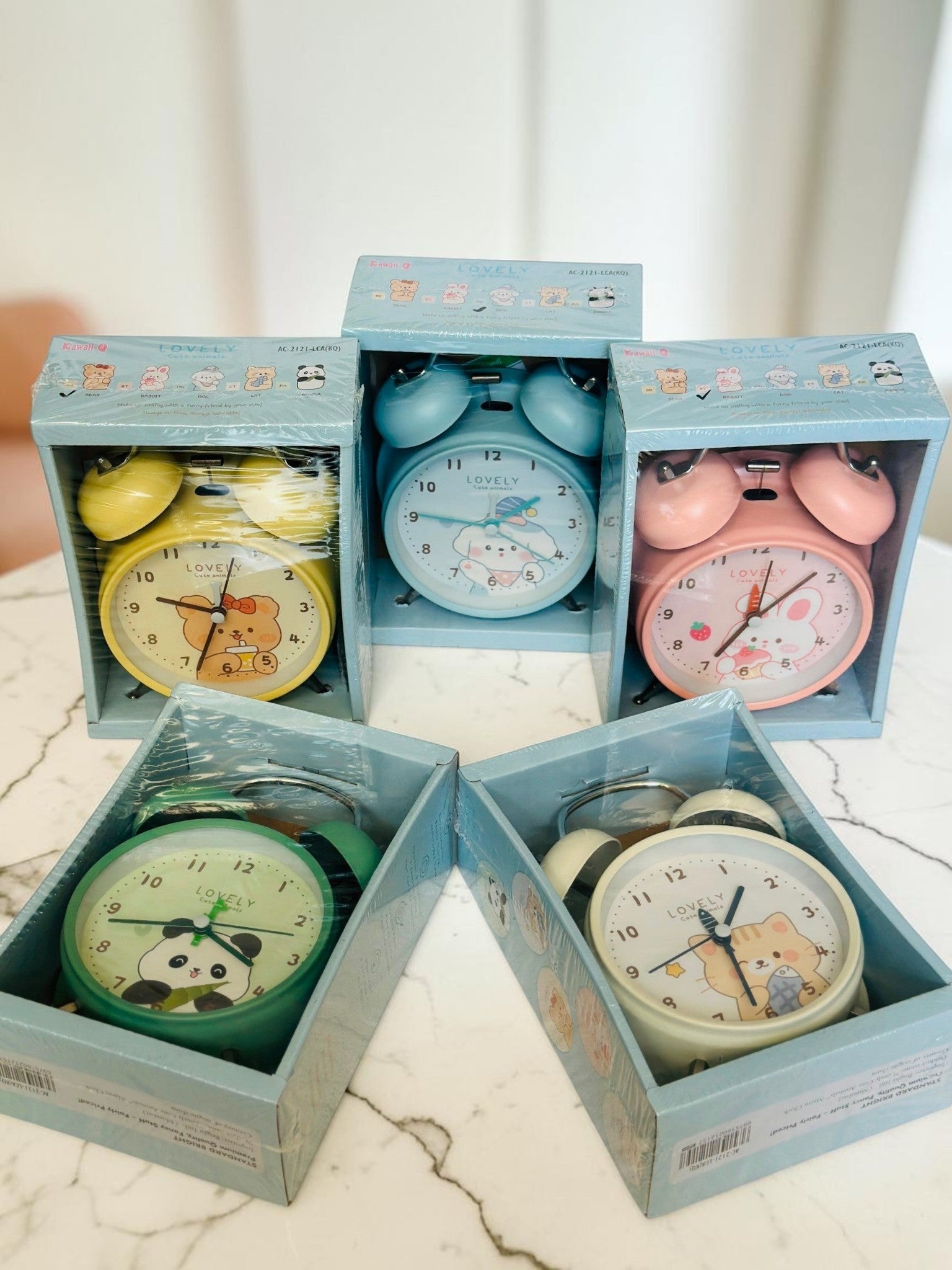 Miso station collection of five colorful pastel twin-bell analog alarm clocks with cute animal illustrations