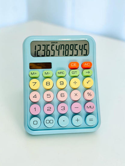 Miso station pastel desktop calculator with large, multi-colored circular buttons and a clear LCD display screen.