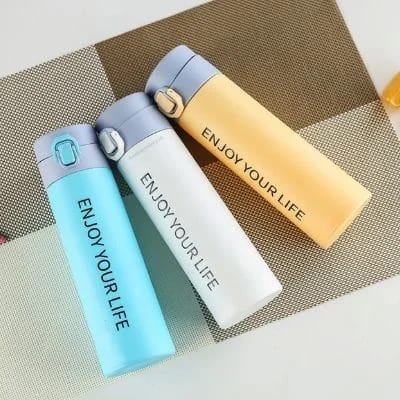 Miso station stainless steel insulated water bottles in pastel blue, white, and yellow with Enjoy Your Life print.