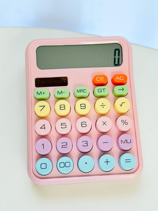 Miso station pastel pink desktop calculator with large, multi-colored circular buttons and a clear LCD display.