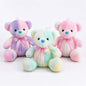 Miso station pastel tie-dye plush teddy bears with satin ribbon bows in purple, blue, pink, and yellow.