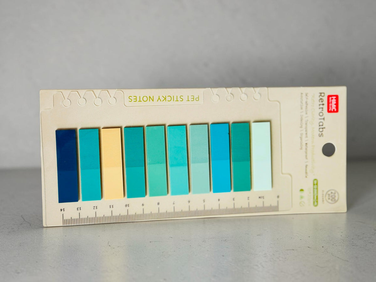 Miso station HIMIC RetroTabs PET adhesive page markers in a gradient of blue and green shades on a ruler backing card