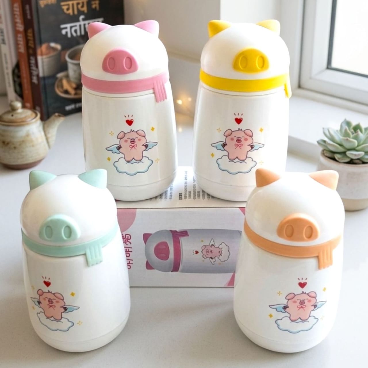 Miso station MengMengzhu pig-themed stainless steel insulated water bottles with colorful lids and angel pig graphics.