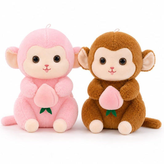 Miso station soft plush monkey toys in pink and brown, each sitting and holding a small embroidered peach.