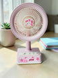 Miso station pink portable desk fan with a cute cartoon cat character centerpiece and simple control buttons.