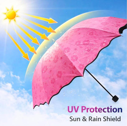 Miso station pink floral umbrella with scalloped edges providing UV protection against a sunny blue sky background.