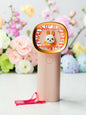 Miso station portable handheld fan in pastel pink with a cute rabbit character and gold-tone rim and wrist strap.