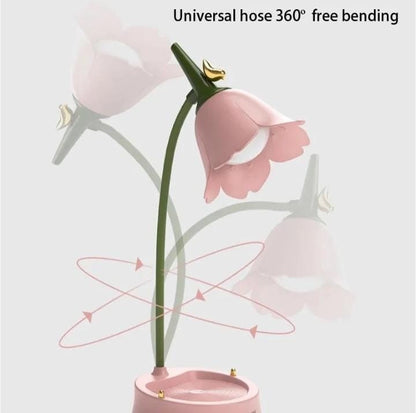 Miso station pink tulip-shaped desk lamp with a flexible green hose neck and integrated stationery storage base.