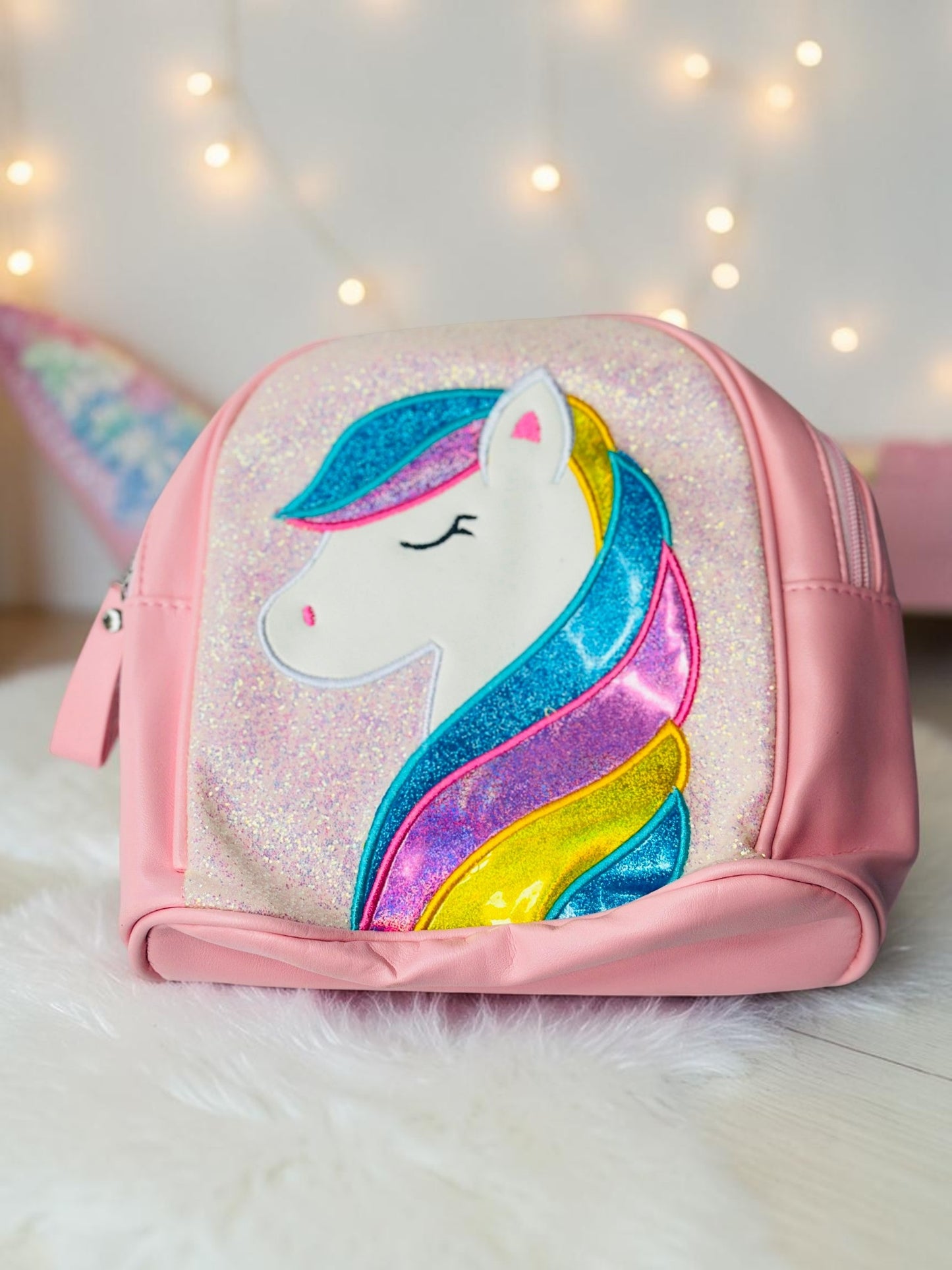 Miso station pink unicorn mini backpack with a glittery front panel and a vibrant multi-colored mane appliqué