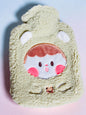 Miso station plush hot water bottle cover in light green fleece with an embroidered cute character face and 3D ears.
