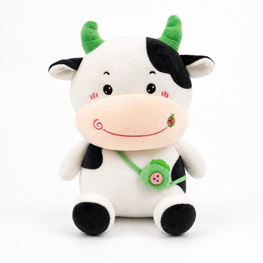 Miso station plush cow toy with black and white spots, green horns, and a cute green crossbody bag.