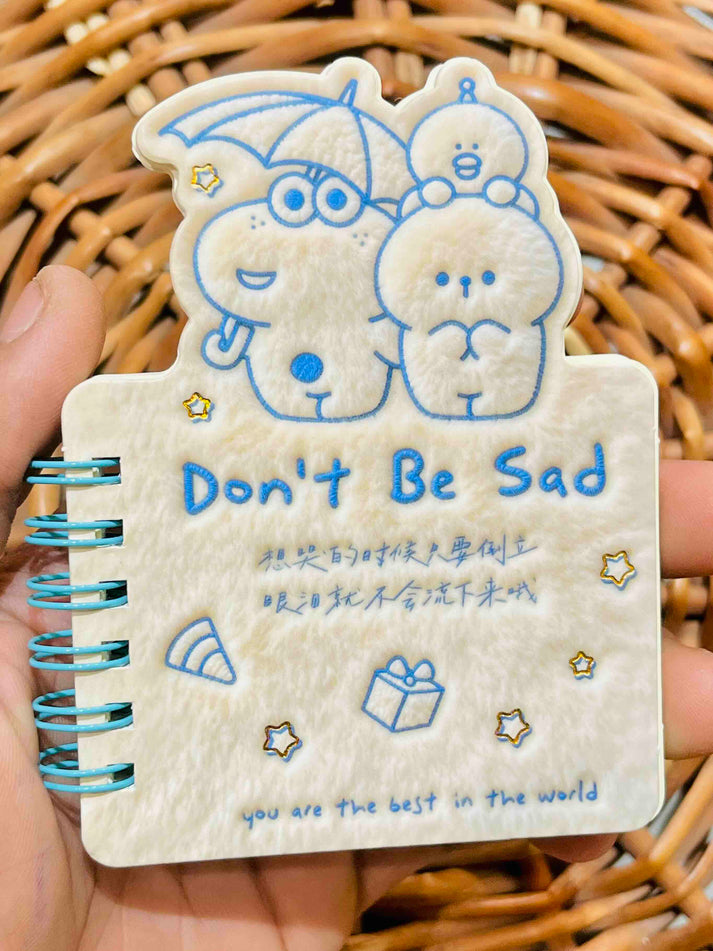 Miso station plush spiral memo notepad with a cute cartoon character cover and Don't Be Sad text in cream color