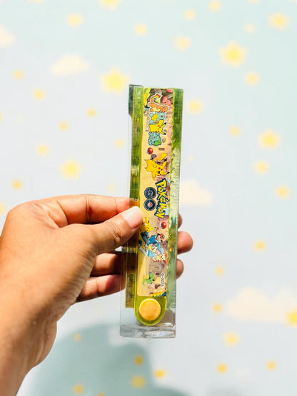 Miso station Pokemon themed folding plastic ruler with colorful character graphics held in a hand