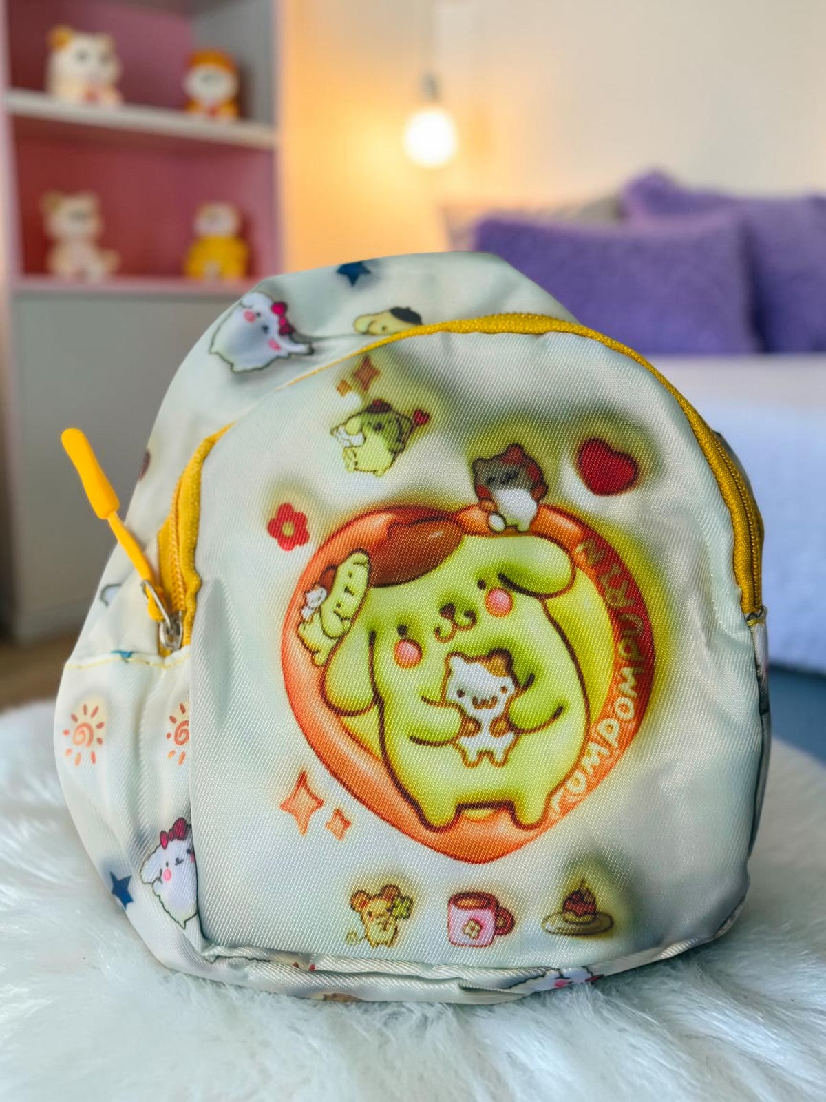Miso station Pompompurin mini sling backpack with yellow zipper and cute character print on a white background