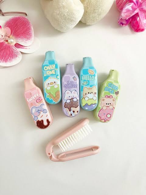 Miso station portable folding hair brushes in pastel colors with cute kawaii animal and dessert character designs.