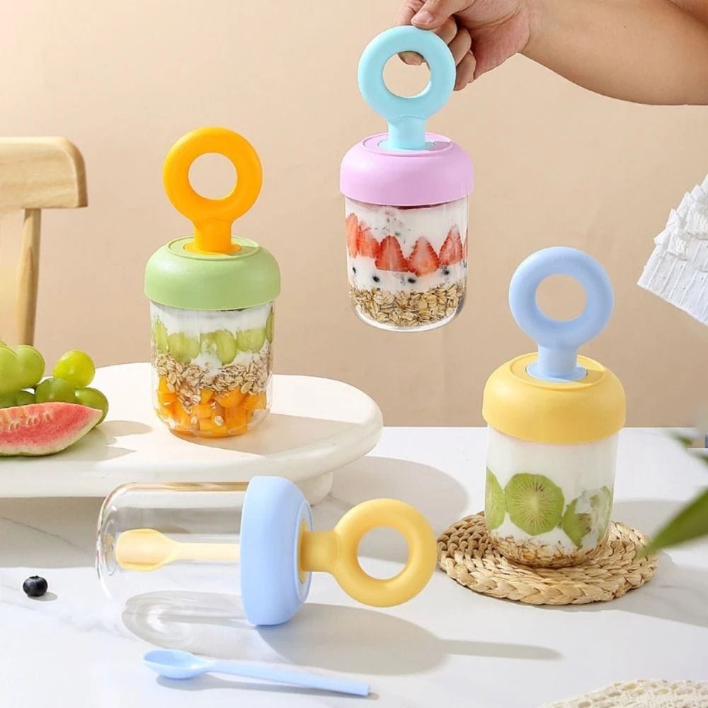 Miso station portable yogurt and fruit breakfast cups with pastel lids, integrated spoons, and clear containers.