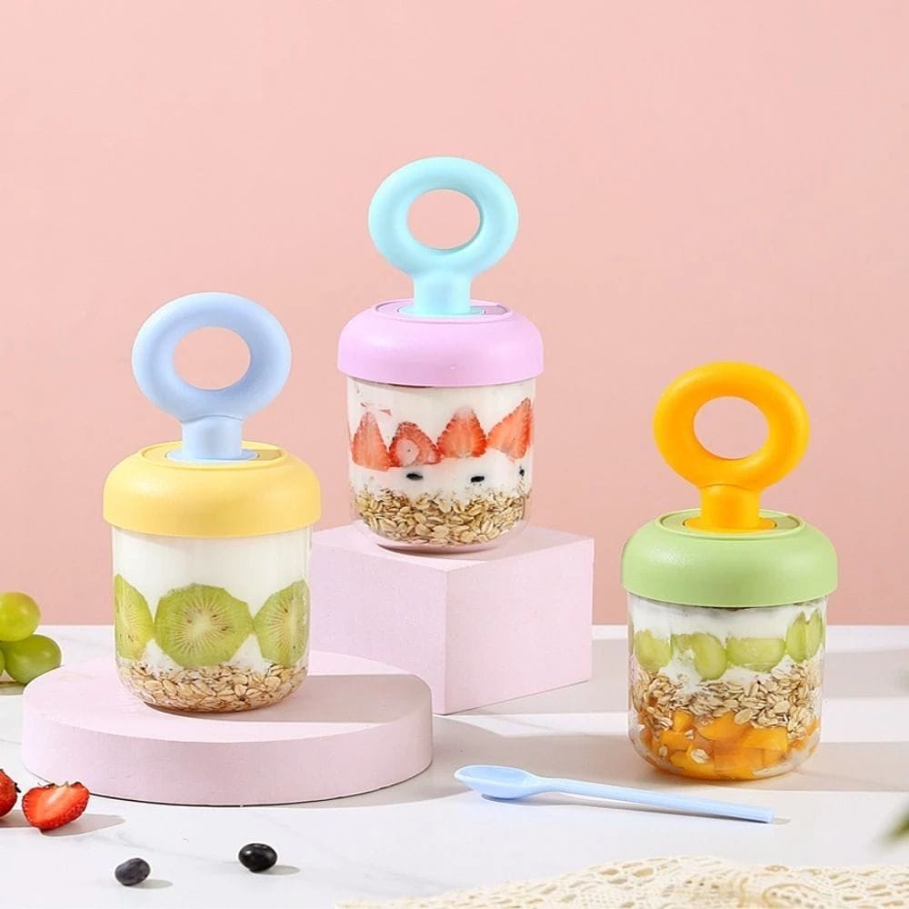 Miso station portable yogurt and fruit cups with pastel lids, integrated spoons, and clear containers on pink stands.