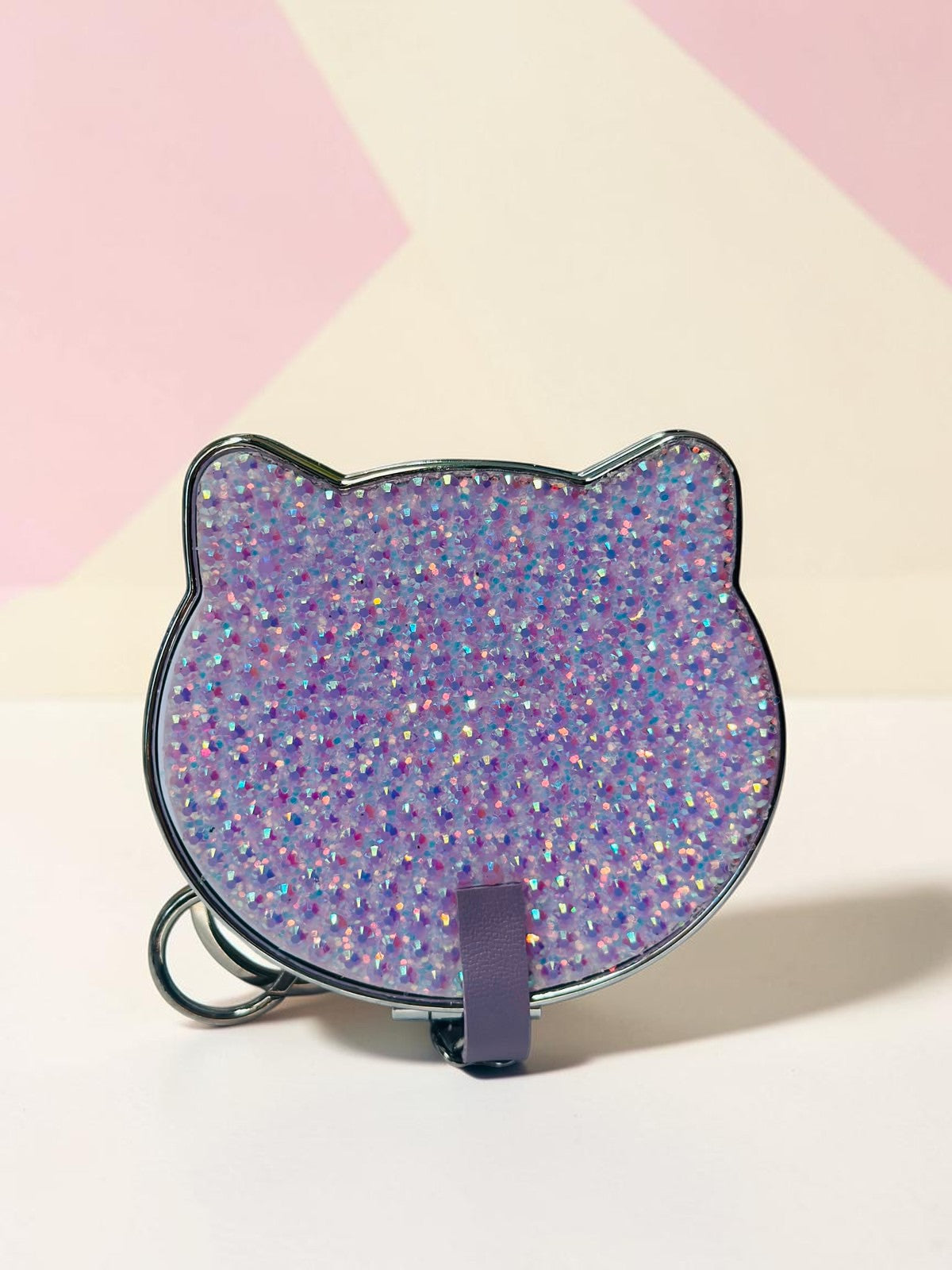 Miso station cat-shaped compact mirror with a purple glitter finish, metallic edge, and a convenient keychain strap.