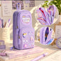Miso station purple multi-compartment stationery pouch with 3D resin charms and glitter heart window on a desk