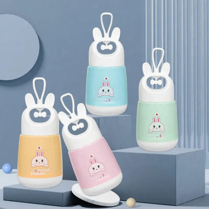 Miso station portable rabbit water cups in pastel yellow, pink, blue, and green with cute ear-shaped carry handles.