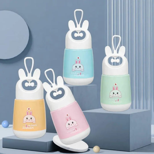 Miso station portable rabbit water cups in pastel yellow, pink, blue, and green with cute ear-shaped carry handles.