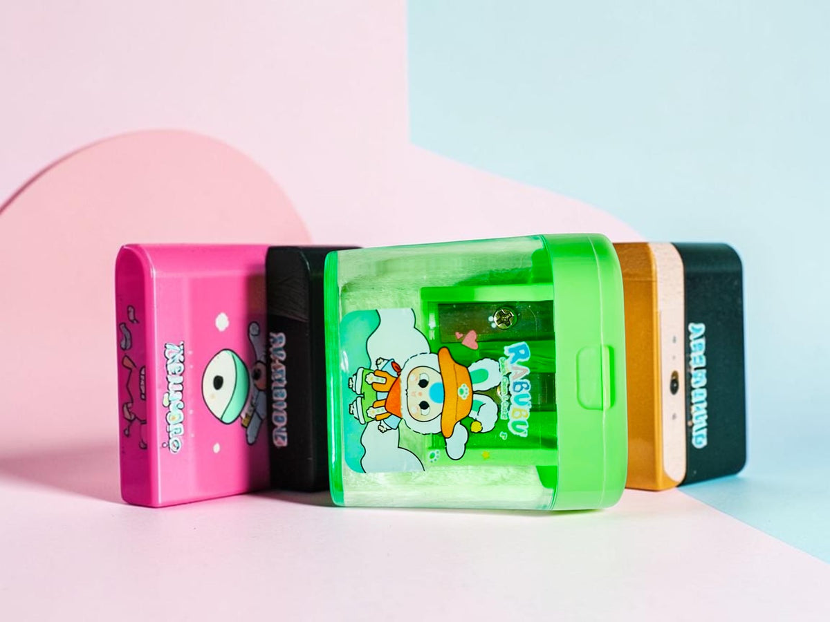 Miso station RABUBU green two-hole pencil sharpener with a transparent body and cute character illustration