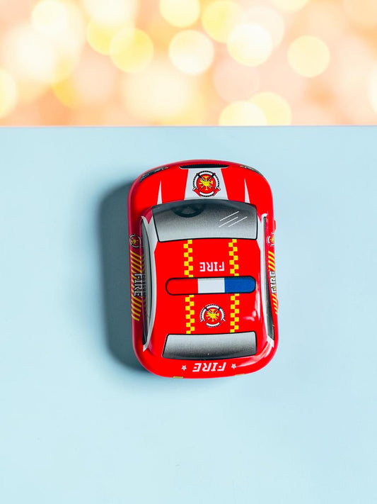 Miso station red metal fire department toy car with authentic graphics viewed from above on a light blue surface