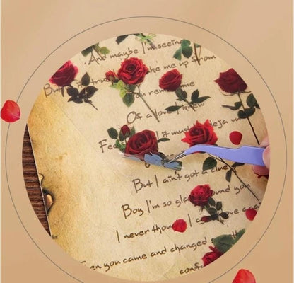 Miso station botanical rose stickers being applied with tweezers onto vintage-style paper for scrapbooking.
