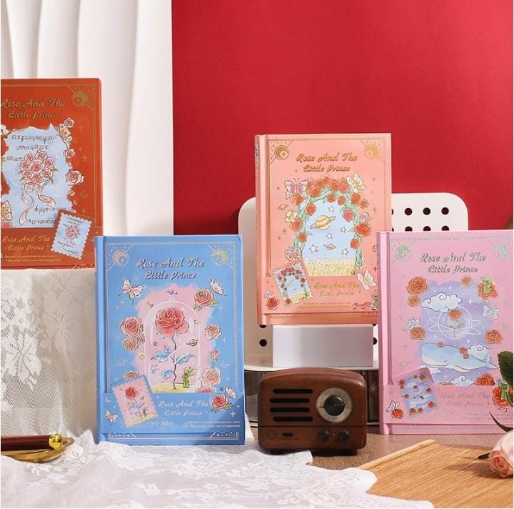 Miso station Rose and the Little Prince hardcover journals in blue, pink, and orange with gold-foil floral designs.