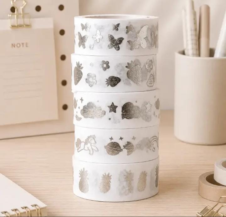 Miso station decorative washi tape set featuring silver foil patterns of butterflies, fruit, and clouds on a desk.
