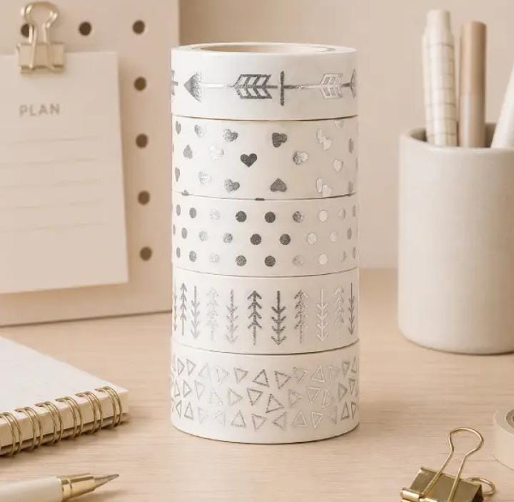 Miso station decorative washi tape set featuring silver foil patterns like hearts and geometric shapes on a desk.